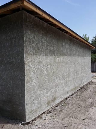Finished stucco carried around the corner with an even texture throughout