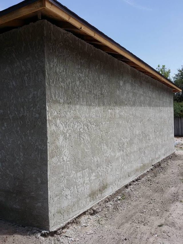 Finished stucco carried around the corner with an even texture throughout