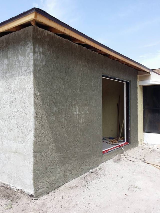 The door opening finished, stucco returned cleanly into the reveal