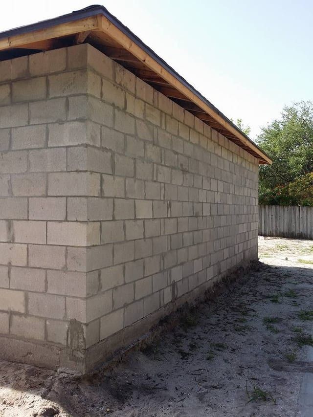 The same addition from the opposite corner, still bare block