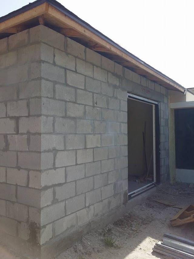Bare block wall with the sliding door opening framed out