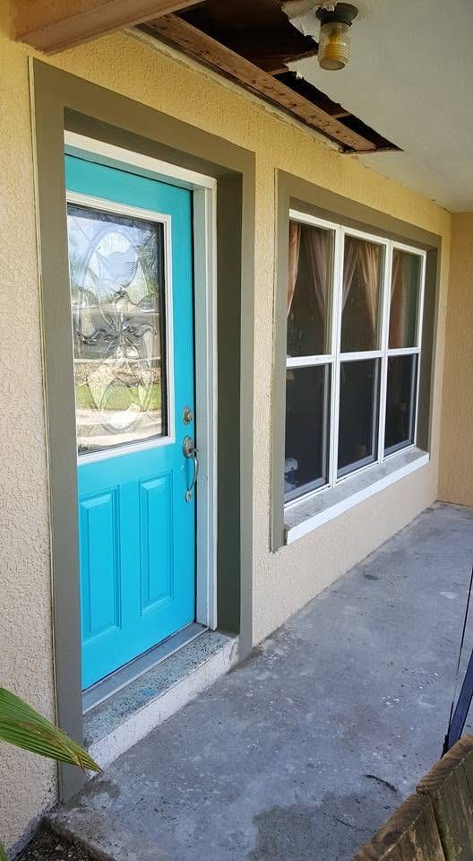 The finished door and window together, no outline showing where the openings were cut