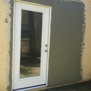 The closed-up opening after finishing, the patch blended into the surrounding wall