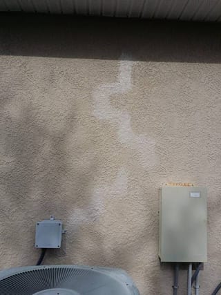 Same wall close-up after the damaged section was cut out and patched